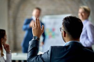 Man raising hand for q&a session